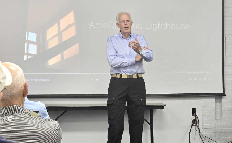 Robert Eberle, a 10-year resident of the island who is a former Associated Press photographer, talks about the documentary he made about the Amelia Island Lighthouse. Photo by Ashley Chandler/News-Leader