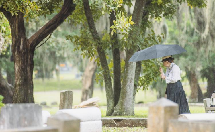 Karen Antworth portrayed Mrs. Alice Padgett Swearingen, wife of former Florida Attorney General and Mayor of Jacksonville, Van Cicero Swearingen, walks nearby the location of Swearingen’s gravesite at Bosque Bello Cemetery. The Amelia Island Museum of History held the Graveside Chronicles: Tales of Life, Love, and Legacy on Saturday at the cemetery. Photo by Ashley Chandler/News-Leader