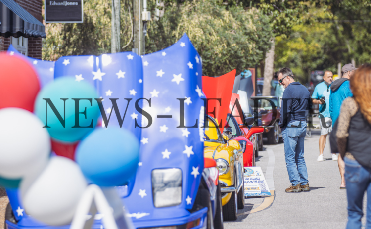 People check out automobiles during the 30th Annual 8-Flags Car Show on Saturday in Downtown Fernandina Beach. Photo by Ashley Chandler/News-Leader