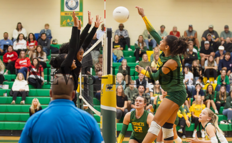 Yulee High School senior Kaveri Harris looks for the kill in Wednesday’s playoff game against Bishop Kenny. Photos by Ashley Chandler/News-Leader