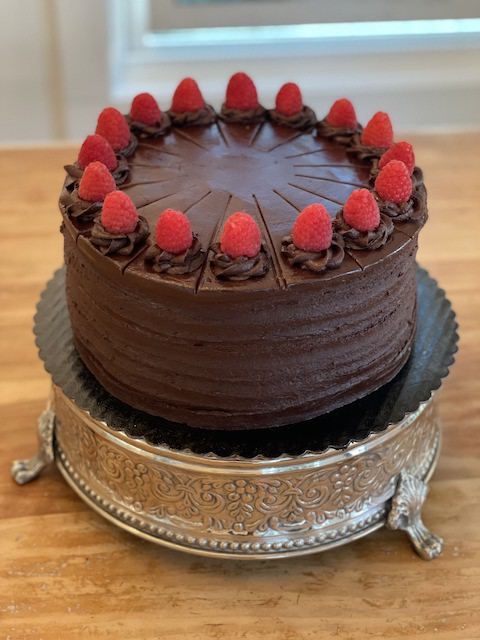 Fresh 5-layer chocolate cake with a raspberry peach filling.