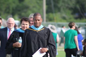Yulee High School principal Roody Joinville leads a procession prior to the school’s graduation May 25.