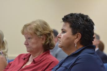 Nassau County School District board chairwoman Donna Martin and superintendent Kathy Burns attend a Nassau County Commissioners meeting in June, where the commissioners voted to add an additional mill to the ballot for voters to decide upon. Photo by Marissa Mahoney.