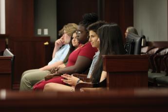 Teen volunteers prepare for their roles on the jury. Photo by Holly Dorman.