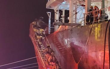 Firefighters board the Amber Star, a ship that caught fire at the Port of Fernandina on the evening of June 26. The Fernandina Beach Fire Department had the fire out by 6:30 a.m. Monday morning. Photo courtesy Fernandina Beach Fire Department.