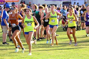 The Fernandina Beach High School girls cross country team competes in the Katie Caples Invitational at Bishop Kenny Saturday. The team finished second. Photo by Stephanie Nichols.