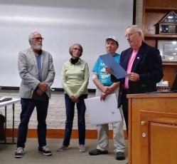 Chuck Olivia, Theresa Hartz and Richard Timm, from left, accept the proclamation Fernandina Beach Mayor Mike Lednovich reads aloud declaring November 2022 as Right Whale Month at the Oct. 18 City Commission meeting. Submitted photo.