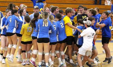 Fernandina Beach High School’s volleyball team (20-5) and fans celebrate the Lady Pirates’ win over Beachside Tuesday night. FBHS advanced to the region quarterfinal round and head to Bishop Kenny tonight to take on the top-seed Lady Crusaders. The match starts at 7 p.m. Photo by Beth Jones/News-Leader