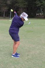 Shauna Snyder, military liaison and employment manager at the On Course Foundation, takes a swing at the Amelia River Club. Photo by Holly Dorman/News-Leader