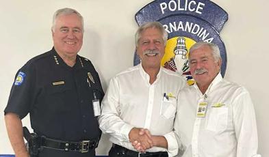 The new chairperson for the Fernandina Police Foundation, retired Fernandina Beach Police Officer Kevin Kozak, is welcomed by, from left, Chief of Police James Hurley, Kozak and Harry Kegler. Submitted photo