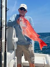 Local fisherman holds a recently caught red snapper. Submitted photo