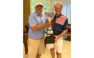 Steve Swecker, MGA president, presents the Tarlow Cup trophy to this year’s winner, Todd McGohan. Submitted photo