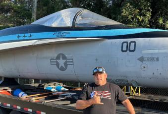Dewey Larson with his F/A-18 aircraft. Submitted photo