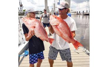 Capt. Danny Flynn and son, Aiden, are pictured with two large Amelia Island red snapper caught just a few miles offshore of Amelia Island during the 2022 red snapper two-day season. Photo by Terry Lacoss/Special