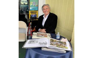 Artist William Maurer and his book Sketches of Amelia Island and Fernandina Beach.  Photo courtesy of Jennean Veale