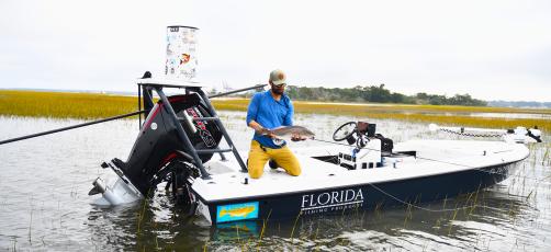 Targeting hard-fighting redfish on a flooded spartina marsh from a shallow water skiff was the ultimate redfish challenge during 2023. Jerimia Joost is pictured with a beautiful flood tied redfish caught on the fly. Photo by Terry Lacoss/Special
