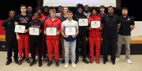 Nassau County Schools Superintendent Kathy Burns congratulates the Hilliard Flashes varsity basketball team during a Nassau County School Board meeting Thursday as part of her “Superintendent Spotlight” segment. Photo by Kathie Sciullo/Community Newspapers