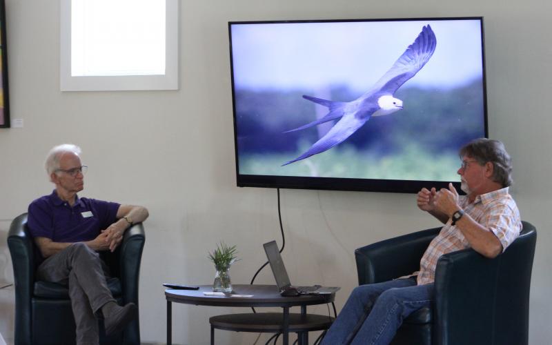 Ken Meyer, right, tells the story of how he got into swallow-tailed kite research, something he’s been doing for more than 30 years now. With Meyer is Story & Song Bookstore Bistro co-owner Mark Kaufman.