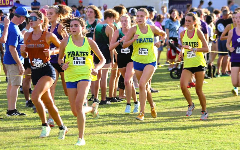 The Fernandina Beach High School girls cross country team competes in the Katie Caples Invitational at Bishop Kenny Saturday. The team finished second. Photo by Stephanie Nichols.