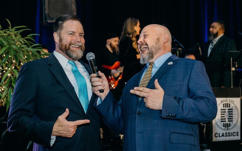 Aaron Bean, left, and John Drew, gala auctioneer and emcee, respectively, kept the crowd — and themselves — engaged during the festivities. Photo by Page Teahan Photography