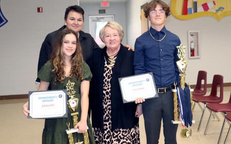 Yulee High School seniors Tyler Osborne and Aliyah Guzman placed first in the Florida Civics and Debate Initiative in Orlando April 1. Teacher Janice Van Delinder and Superintendent Kathy Burns join them. The Nassau County School Board met at Hilliard Elementary School Thursday night. Photo by Kathie Sciullo/Nassau County Record