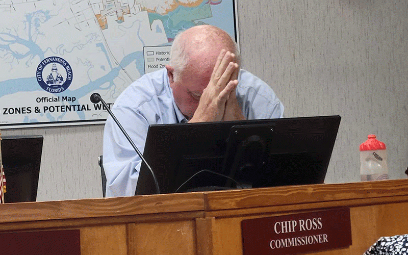 Fernandina Beach City Commissioner Chip Ross listens to fellow commissioners as they discuss the role of a citizens committee and a professional executive search firm in the process of hiring a new city manager. He said any potential hires would be watching the city, and would hesitate coming to Fernandina after seeing the “ludicrous” way it is going about the process. Photo by Julia Roberts/News-Leader