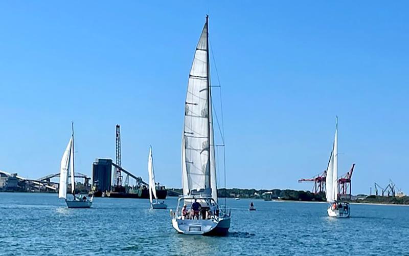 Boats round the first mark, left, during the Amelia Island Sailing Club’s fourth race of the season on Saturday. Misty close-hauled, right. Submitted photo