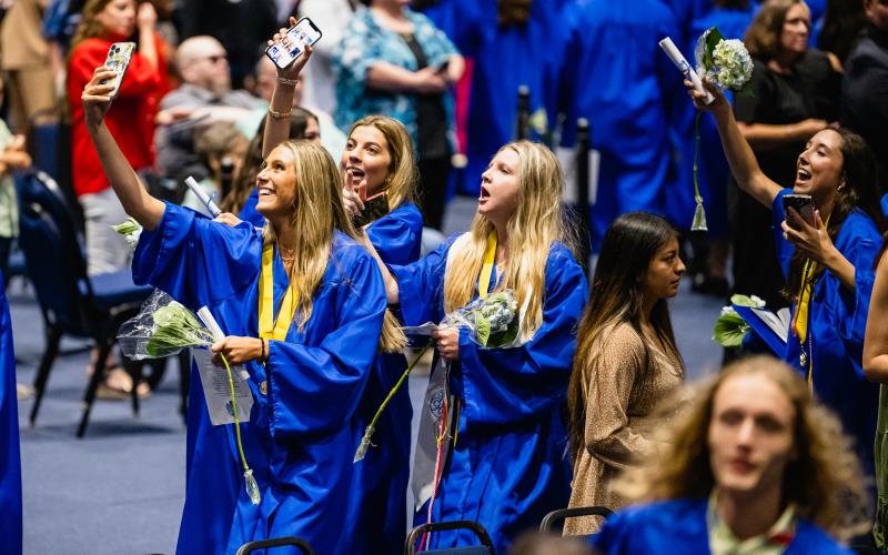 Officially graduated, Fernandina Beach High School grads celebrate with a picture to remember the moment. Penny Glackin/Holly Dorman/News-Leader 
