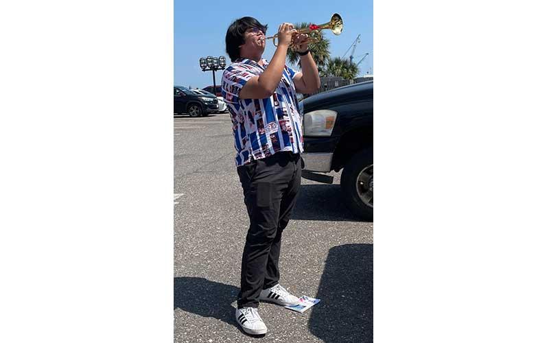 Bugler Kouhei Rocha plays “Taps” at the conclusion of the ceremony. Rocha is a recent high school graduate who currently works at The Surf Restaurant. Submitted photo