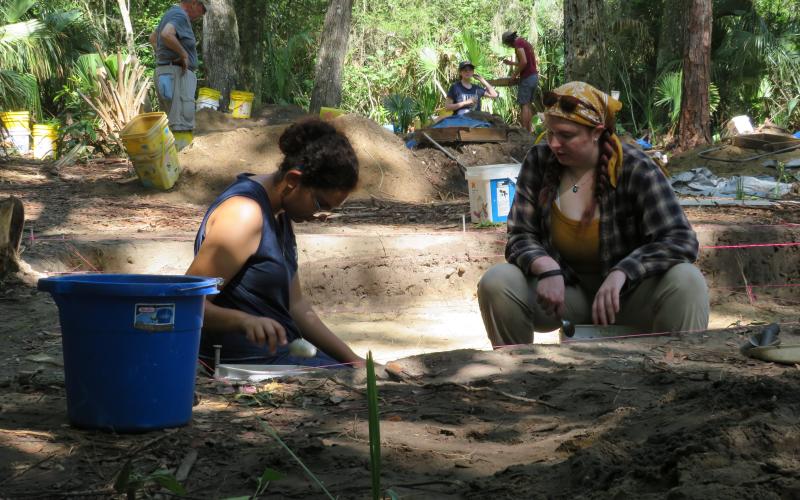 University of North Florida archeology students scoop dirt one spoonful at a time to search for artifacts. With the extra dirt, sifters rake through it searching for anything of note. Photos by Holly Dorman/News-Leader