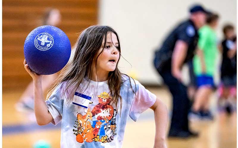 Fernandina Beach police officers stopped by the Fernandina Beach High School gym Tuesday and played dodgeball with the children attending the P.E. Camp this summer. Photos by Penny Glackin/Special 