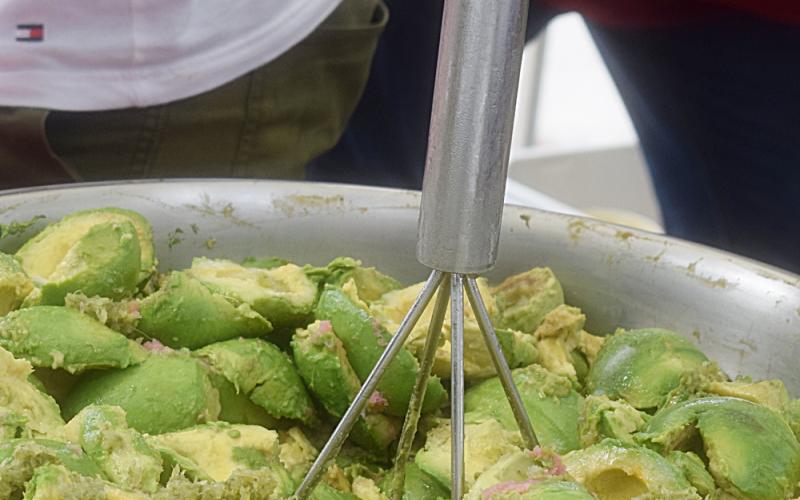 A giant bowl of avocados are about to be turned into fresh guacamole by King of All Guacamole who will be at both markets on Saturday. Photo by Judie Mackie/Special