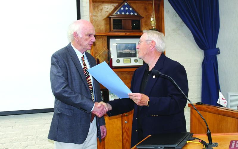 At the Feb. 15, 2022, Fernandina Beach City Commission meeting, then-Mayor Mike Lednovich, right, read a proclamation recognizing former Mayor Ron Sapp for his extensive civic service and unwavering commitment to the city. Photo by Julia Roberts/News-Leader