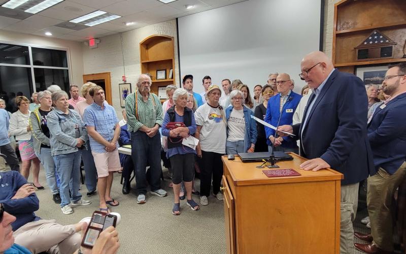 Surrounded by supportive citizens, Fernandina Beach City Commissioner Chip Ross read a proclamation recognizing Transgender Day of Remembrance, after Mayor Bradley Bean declined to do so. Photo by Julia Roberts