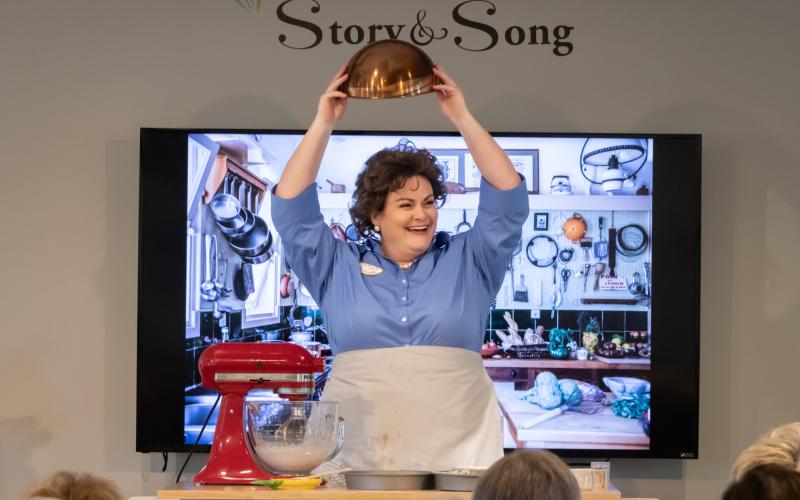 Robyn Marie Lamp bakes a chocolate cake onstage singing Julia Child in Lee Hoiby’s opera, “Bon Appétit!” with Amelia Island Opera. Photo by Lea Lewin Gallardo