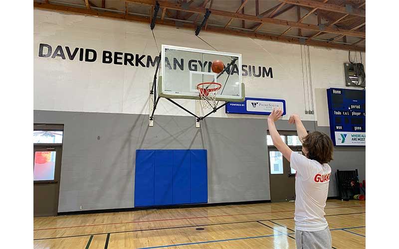 Landon Blake takes a shot in the newly dedicated David Berkman Gymnasium at the McArthur Family YMCA in Fernandina Beach. Photo by Tracy Dishman