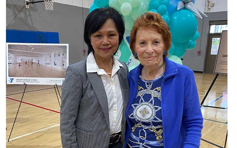 Penny Zuber, left, executive vice president and chief financial officer of First Coast YMCA, stands with Betty Berkman at the David Berkman Gymnasium dedication. Photo by Tracy Dishman