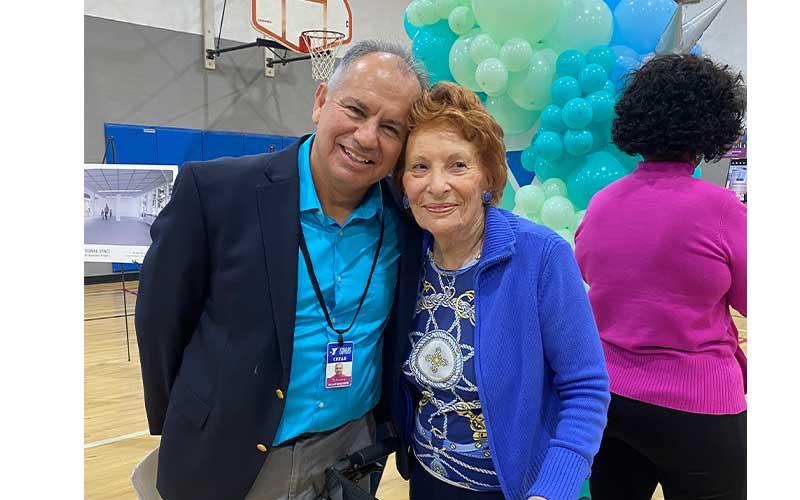 Cezar Gonzalez, YMCA district executive director of the McArthur Family YMCA and YMCA at Wildlight, stands with Betty Berkman at the David Berkman Gymnasium dedication. Photo by Tracy Dishman