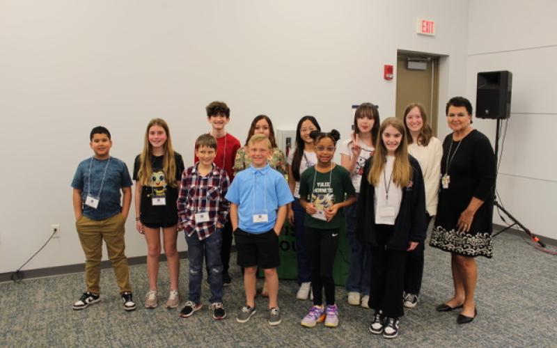 Spelling bee contestants, back row from left, Isaac Wiley, Kennedi Brayton, Nickolas Garnett, Brittanie Galarza-Vergara, winner Cathy Le, Ava Grandey, Elle Adams and Superintendent of Nassau County School Kathy Burns; front row from left, Charles King, Nolan Wood, Darolyn Ford and Lacey Solomon. Submitted