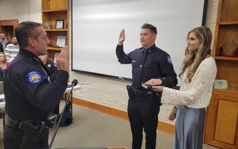 Chief Tambasco swore in newly hired Police Officer Robert Dickson. Photo by Julia Roberts/News-Leader