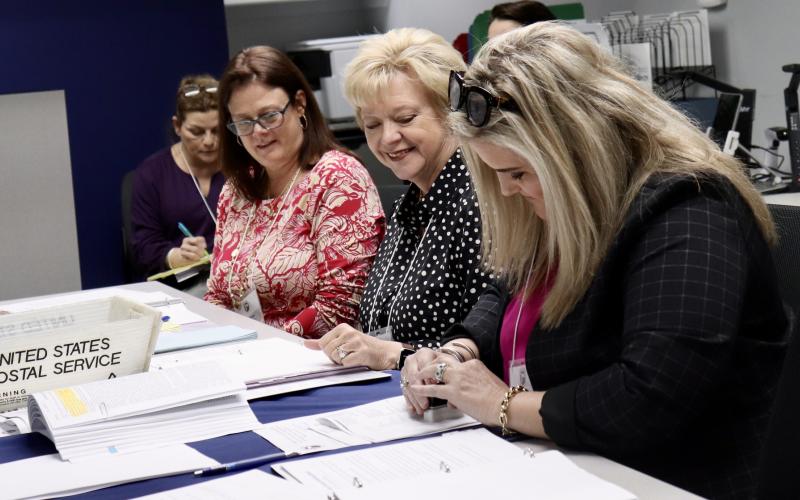 From left, Assistant Supervisor of Elections Maria Pearson, Alternate Canvassing Board member Teresa Prince, Supervisor of Elections Janet Adkins and Judge Jenny Higginbotham, elections staff, election workers and the Nassau County Canvassing Board complete the Logic and Accuracy Test on the voting and audit equipment in preparation for the March 19 Presidential Preference Primary Election. Submitted