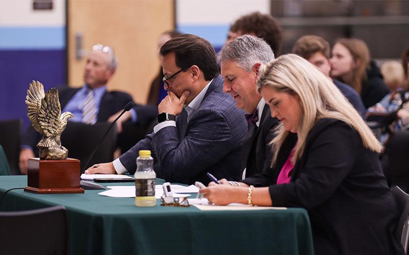 From left, Constitution Bowl judges Judge Adrian Soud, Judge Jim Daniel and Judge Jenny Higginbotham contemplate an answer for a final decisions. Photo by Ashley Chandler/News-Leader