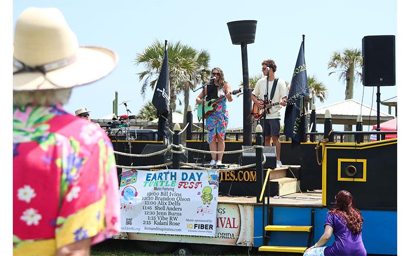 Jenn Burns performs Saturday at Main Beach Park during Earth Day Turtle Fest. Burns also was the music coordinator for Turtle Fest. Photo by Ashley Chandler/News-Leader
