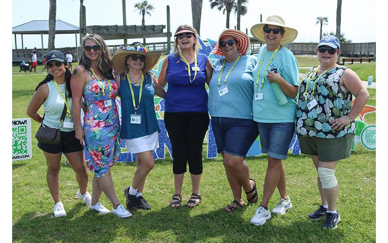 The event coordinators, from left, Vanessa Muzayen, Jenn Burns, Jackie Pagnucco, Amy Beach, Kandra Wells, Vicky Strommen and Kim Galvin pose together at the Earth Day Turtle Fest event held Saturday at Main Beach Park in Fernandina Beach. Photo by Ashley Chandler/News-Leader